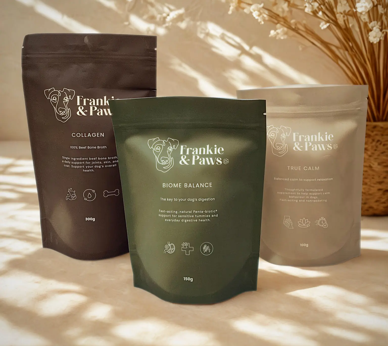 The Frankie & Paws launch range — Collagen, Biome Balance and True Calm pouches grouped together on a sunlit cream surface